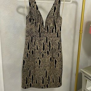 Sexy, fitted, fun never-worn cocktail dress with tags on.